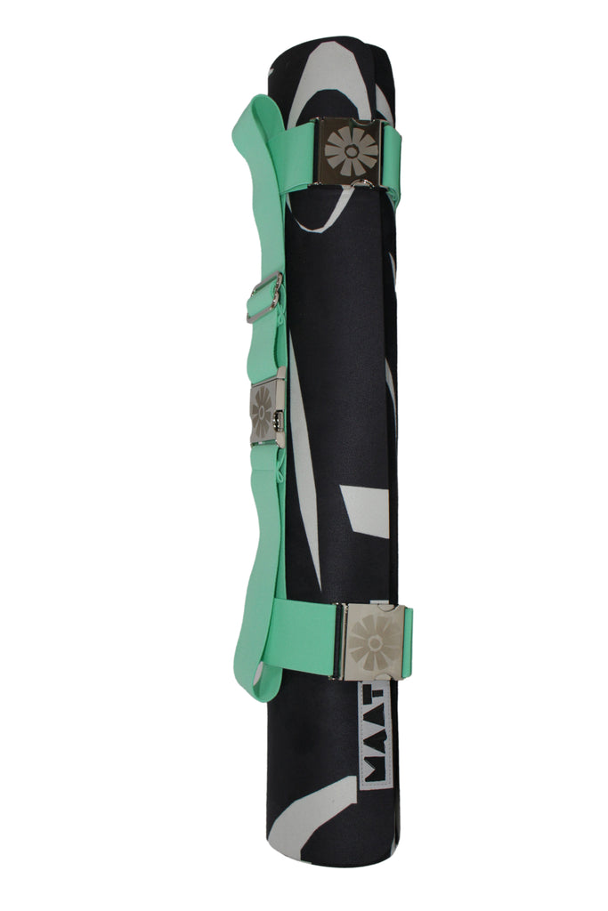 Black mat with green straps and 'MAAT' branding on a white background