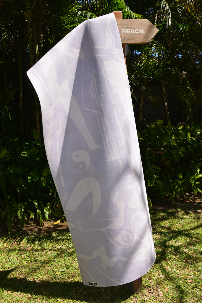 Yoga mat hanging from a beach sign