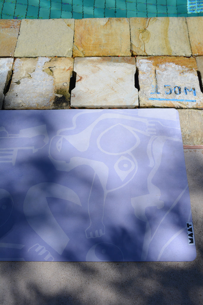 Yoga mat flat lay next to a pool