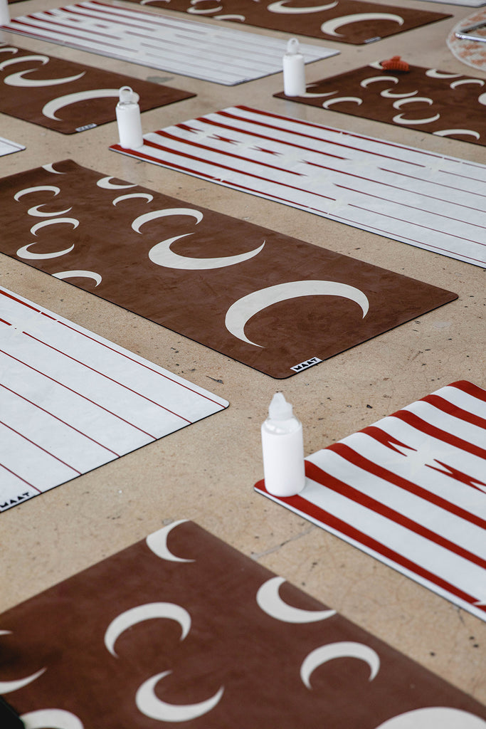 Yoga mats lined up on the floor