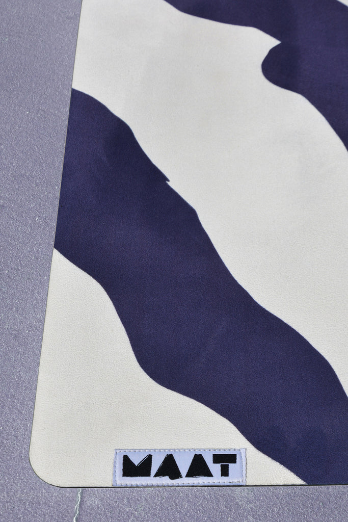 Closeup product shot yoga mat left corner concrete floor