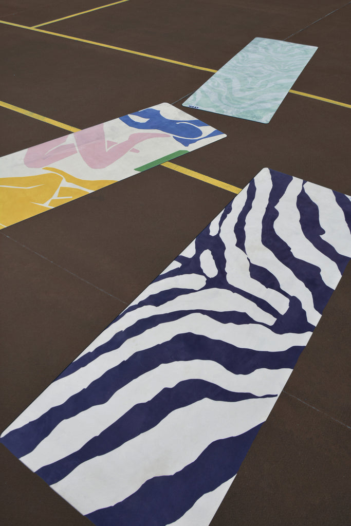 three printed yoga mats product shot flat brown and yellow tennis court