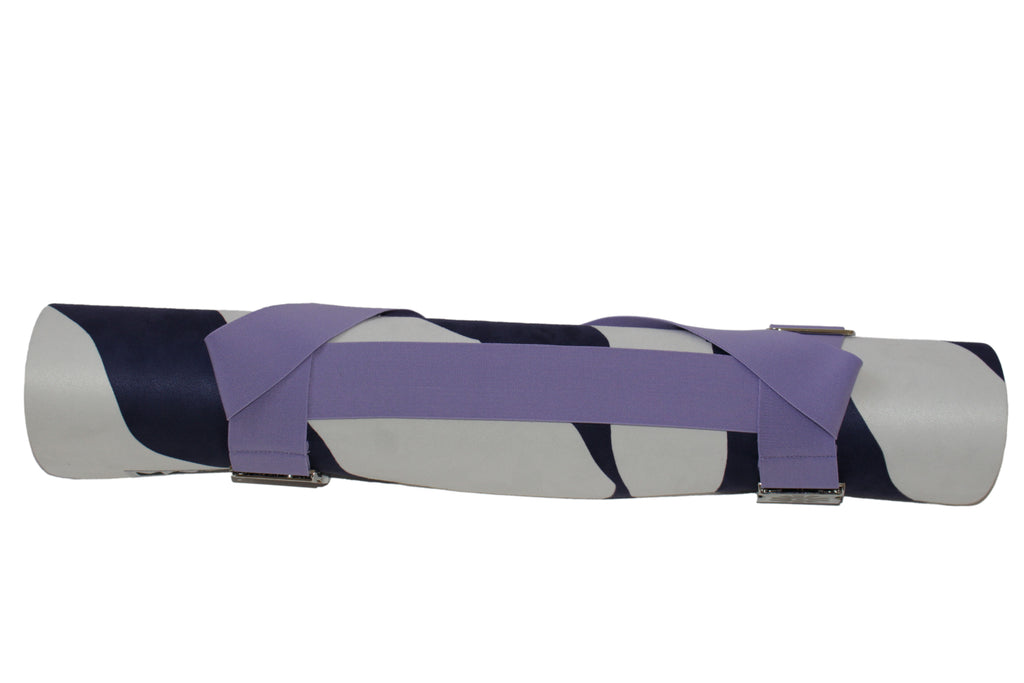 Yoga mat with purple strap on a white background