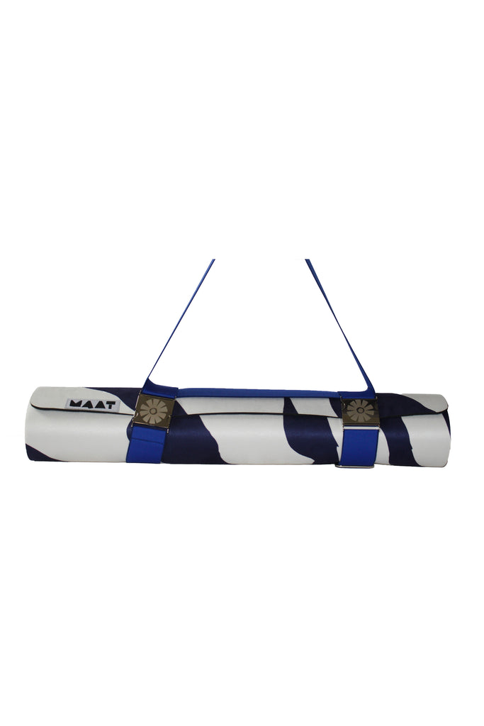 Blue strap around rolled up 'zebra' yoga mat