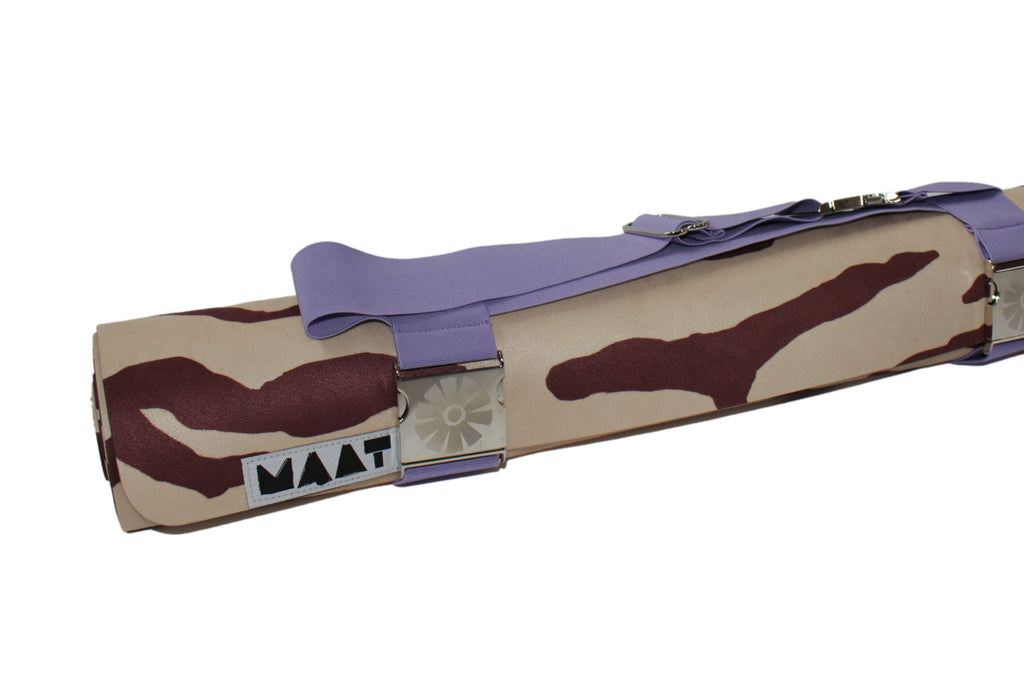 Lilac strap around rolled-up 'tiger' yoga mat