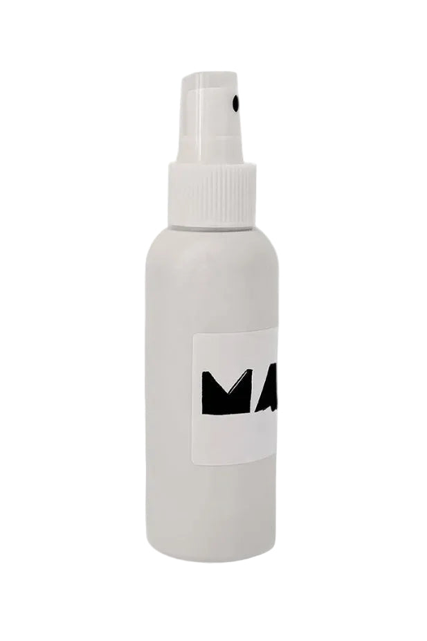 White spray bottle with a black logo on a white background