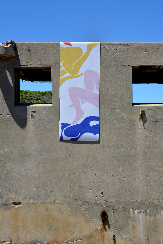 Flatlay mat hanging on the concrete wall with two windows