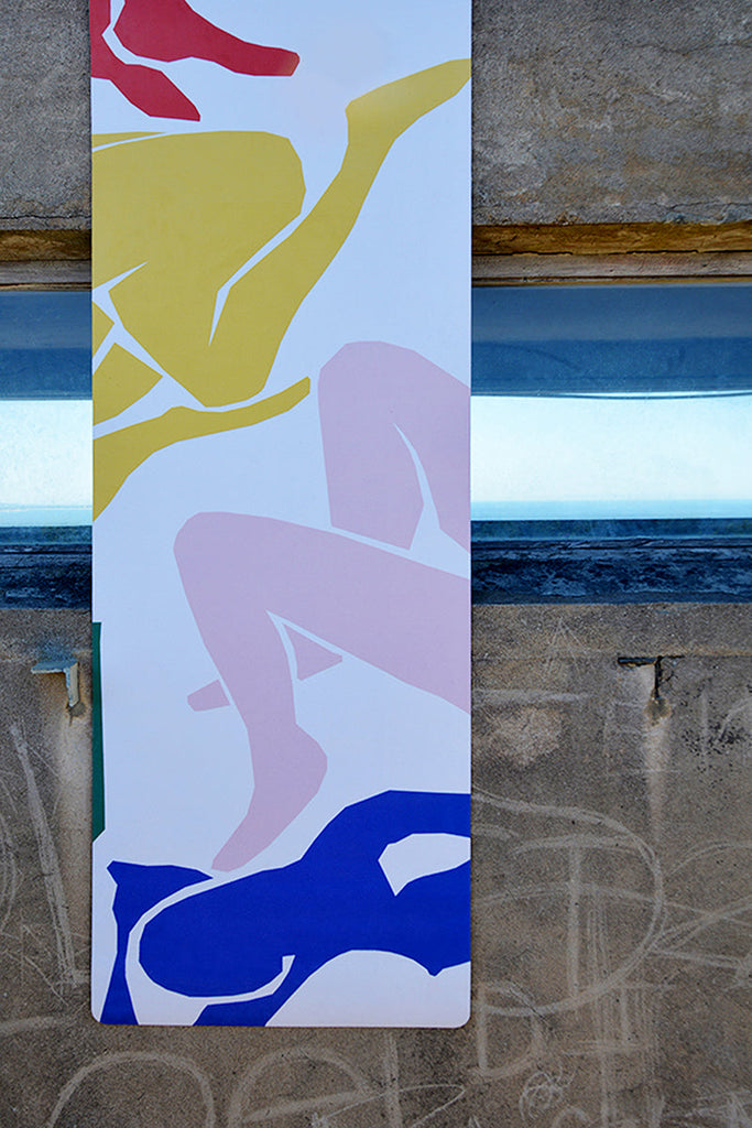 product shot of mat hanging on the concrete wall with window