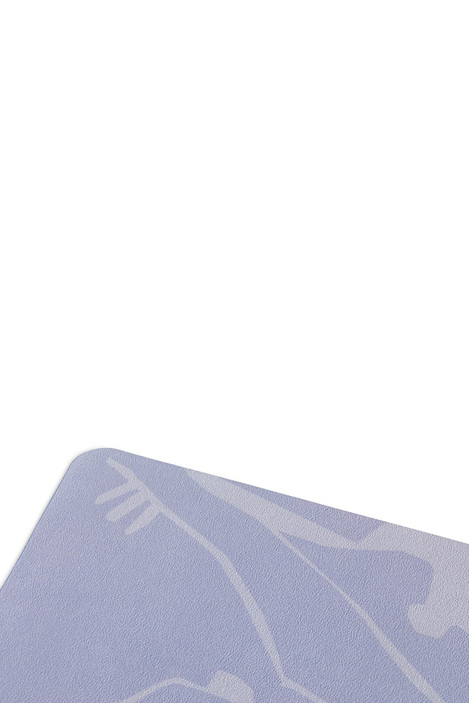 close up detail shot of the corner on a suede yoga mat 