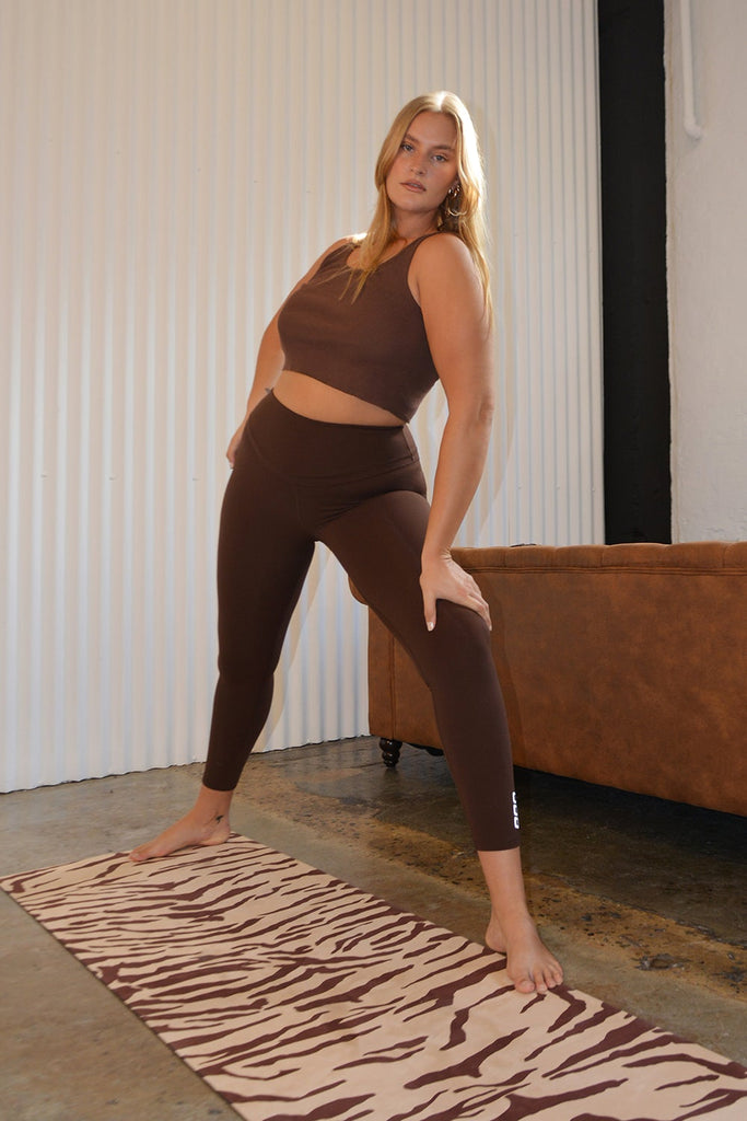 Girl lunges on the mat